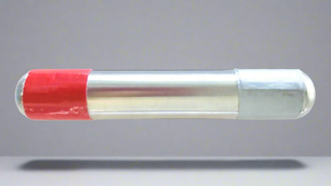 Cylinder with red and silver bands on a gray background