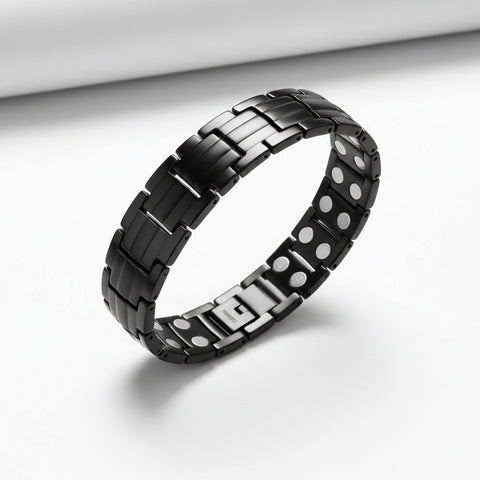 Black metal bracelet with silver accents on a white background