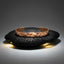 A hammered copper cuff bracelet displayed on a dark textured stone against a dark gray gradient background.