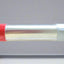 Cylinder with red and silver bands on a gray background