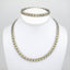 Conjunto V B-NL de plata con corazón dorado