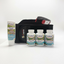 A Dr. Sierra's Naturals wellness set on a white tabletop, featuring a Pain-Less Cream tube, three supplement bottles labeled Inflamm Health & Joint, Relax-S, and Lig-Disc & Joint, a black magnetic cushion, and a grooming brush with a red handle.